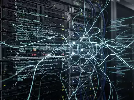Glowing lines of code flow across a dark server rack, representing data encryption and network security. - Foto: über boerse-global.de