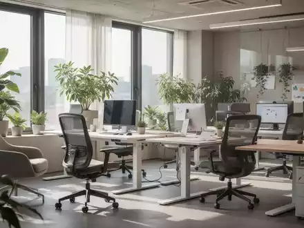 Ein modernes, ergonomisches Bürointerieur mit viel Tageslicht, Pflanzen, höhenverstellbaren Schreibtischen und bequemen Stühlen. - Foto: über boerse-global.de