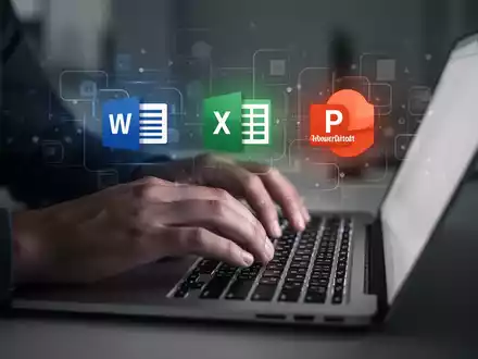 A person typing on a laptop, with blurred digital icons representing Microsoft Office applications floating above the keyboard. - Foto: über boerse-global.de
