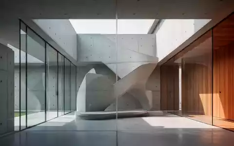 Eine moderne minimalistische Villa mit klaren Linien, großen Glasflächen und Sichtbeton, umgeben von Natur. - Foto: über boerse-global.de