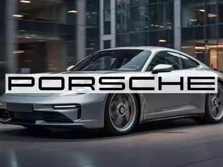 Ein glänzender, moderner Porsche Sportwagen steht in einer stilvollen Umgebung, beleuchtet mit professionellem, optimistischem Licht. - Foto: über boerse-global.de