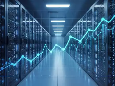 A futuristic data center with glowing blue server racks and a subtle, upward-trending financial graph overlaid on the image. - Foto: über boerse-global.de