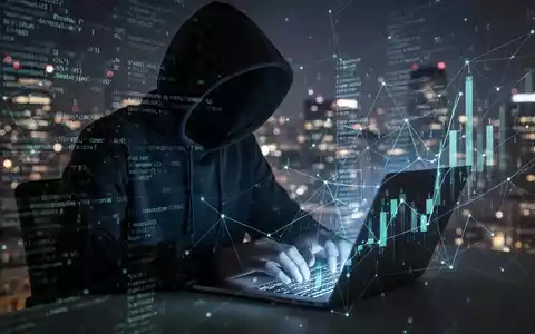 A shadowy figure in a hoodie typing on a laptop, surrounded by abstract digital code, symbolizing cyberattacks on the financial industry. - Foto: über boerse-global.de