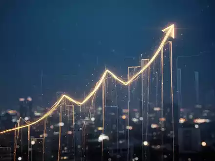Ein stilisierter, goldener Finanzgraph, der einen Höhepunkt erreicht, mit verschwommenen Lichtern im Hintergrund. - Foto: über boerse-global.de