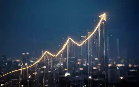 Ein stilisierter, goldener Finanzgraph, der einen Höhepunkt erreicht, mit verschwommenen Lichtern im Hintergrund. - Foto: über boerse-global.de