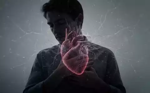 Eine nachdenkliche Person hält sich die Brust, mit einer subtilen Überlagerung eines Herz- oder neuronalen Musters, das die Verbindung zwischen Geist und Herz symbolisiert. - Foto: über boerse-global.de