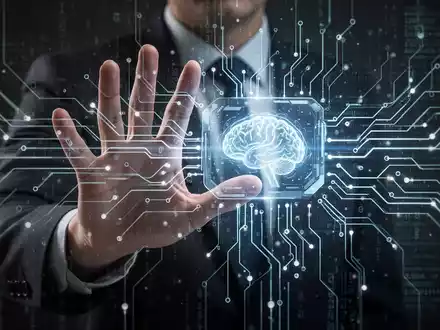 Eine Hand versucht, ein leuchtendes, digitales Interface abzuwehren, das über einem komplexen neuronalen Netzwerk schwebt. - Foto: über boerse-global.de