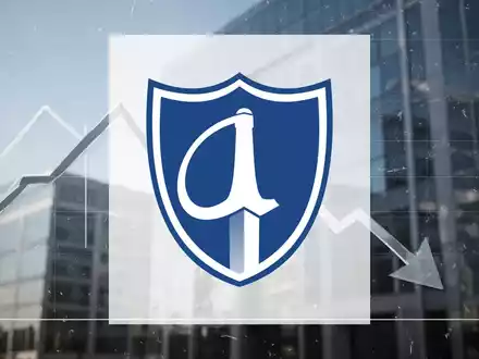 Eine stilisierte Grafik mit Abwärtstrend vor einem unscharfen modernen Bürogebäude, das einen Rabatt auf den Buchwert darstellt. - Foto: über boerse-global.de