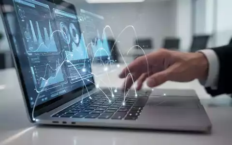 Nahaufnahme einer Laptoptastatur mit schwebenden Linien, die zu einer holographischen Datenvisualisierung führen, mit einer Hand davor. - Foto: über boerse-global.de