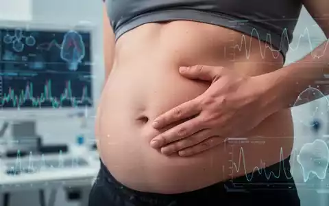 Nahaufnahme eines menschlichen Bauches, der leicht berührt wird, mit unscharfen wissenschaftlichen Grafiken im Hintergrund. - Foto: über boerse-global.de
