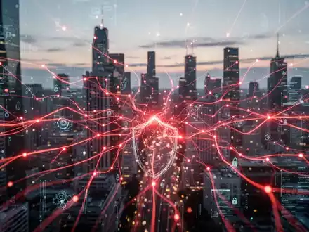 Digital red lines representing a cyberattack on a city's network, with a blurred cityscape in the background. - Foto: über boerse-global.de