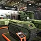 Messestand der estnischen Firma Milrem Robotics, die das unbemannte Fahrzeug Themis vorstellte. - Bild: Wolf von Dewitz/dpa