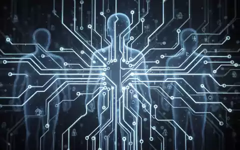 Eine stilisierte Darstellung eines leuchtenden neuronalen Netzwerks oder einer Platine mit verschwommenen menschlichen Silhouetten im Hintergrund. - Foto: über boerse-global.de