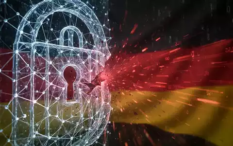Eine digitale Firewall mit roten Datenströmen, die aus einem Riss entweichen, vor einem dunklen Hintergrund mit angedeuteten deutschen Farben. - Foto: über boerse-global.de