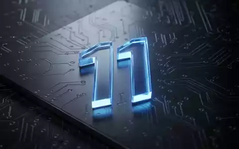A glowing blue Windows 11 logo on a dark, metallic surface with subtle circuit board patterns, symbolizing a technology update. - Foto: über boerse-global.de