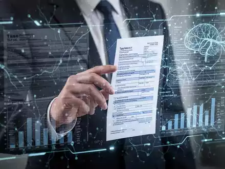 A hand interacts with a holographic tax form interface, showing complex data and AI neural network patterns, symbolizing AI in tax filing. - Foto: über boerse-global.de
