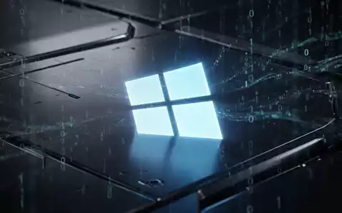 A glowing Windows logo projected onto a dark, sleek metallic surface, with subtle binary code in the background. - Foto: über boerse-global.de