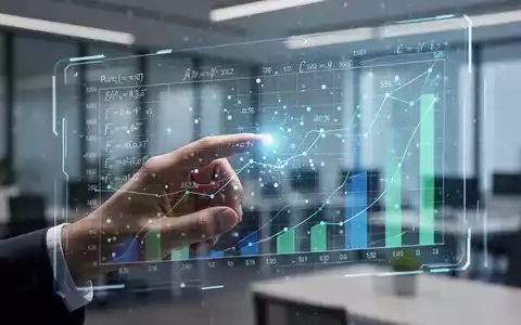 A hand interacts with a futuristic, glowing spreadsheet interface on a transparent screen, showing data and formulas. - Foto: über boerse-global.de