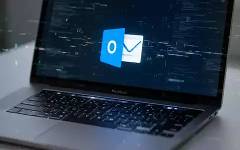 Close-up of a MacBook keyboard with the Outlook icon on the screen, showing a subtle digital glitch. - Foto: über boerse-global.de