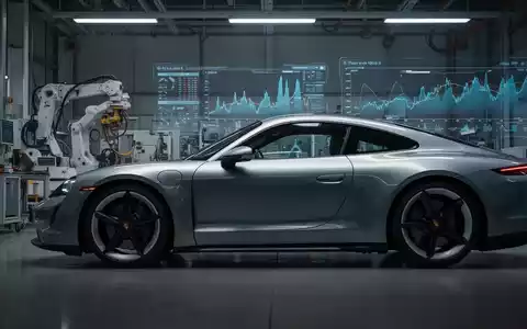 Ein elegantes Porsche-Sportauto in einer modernen Produktionsstätte, mit angedeuteten Finanzgrafiken im Hintergrund. - Foto: über boerse-global.de