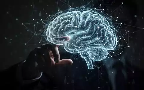 A shadowy hand touches a glowing digital network overlaying a human brain, symbolizing AI, data, and privacy concerns. - Foto: über boerse-global.de