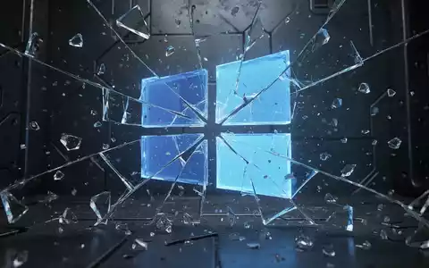 A fractured, glowing blue Windows logo shattering into digital fragments against a dark, metallic background. - Foto: über boerse-global.de