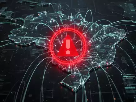 Eine stilisierte digitale Karte Brasiliens mit leuchtenden Linien und einem prominenten roten Warnsymbol, das einen Cyberangriff darstellt. - Foto: über boerse-global.de