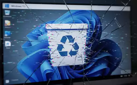 Close-up of a computer screen showing a glitched Windows 11 Recycle Bin icon with digital distortion and pixelation, implying software bugs. - Foto: über boerse-global.de