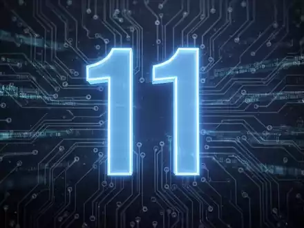 A stylized blue '11' numeral on a circuit board, representing the Windows 11 update. Digital streams flow in the background. - Foto: über boerse-global.de