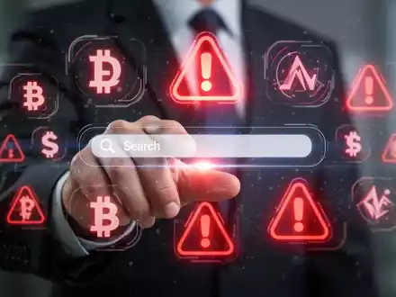 Eine Hand interagiert mit einem holografischen Interface, das Krypto-Symbole und eine Suchleiste mit roten Warnzeichen zeigt. - Foto: über boerse-global.de