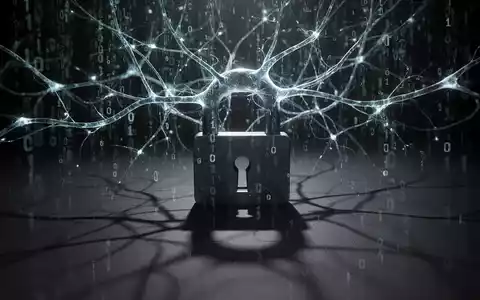A glowing neural network intertwined with binary code, casting a shadow over a padlock, symbolizing AI cyber threats. - Foto: über boerse-global.de