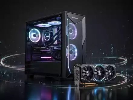 A futuristic gaming PC tower with glowing internal components next to a high-end graphics card, on a dark surface. - Foto: über boerse-global.de