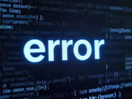 A close-up of a digital screen displaying a prominent blue error message or icon, with blurred background elements. - Foto: über boerse-global.de