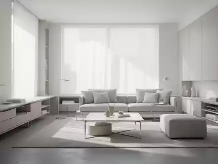 Ein minimalistisches Wohnzimmer mit hellen Wänden, modernen Möbeln und viel Tageslicht, das Effizienz und aufgeräumtes Wohnen symbolisiert. - Foto: über boerse-global.de