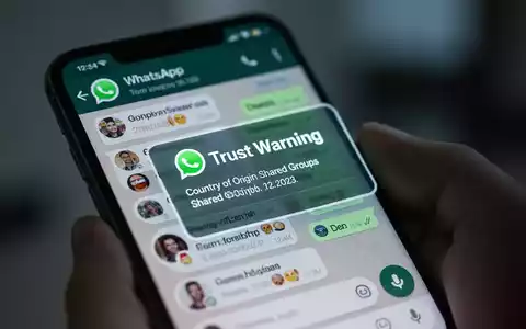 Ein Smartphone-Bildschirm zeigt einen WhatsApp-Chat mit einer 'Vertrauenswarnung' für einen unbekannten Kontakt, mit Angaben zum Herkunftsland und gemeinsamen Gruppen. - Foto: über boerse-global.de