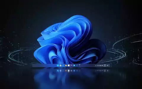 Leuchtend blaue Windows 11 Taskleiste auf dunklem, spiegelndem Desktop mit subtilen digitalen Lichtspuren. - Foto: über boerse-global.de