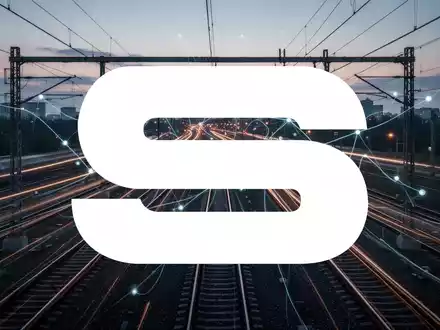 Abstrakte Darstellung eines modernen Eisenbahnsystems bei Dämmerung mit Lichtspuren, die Bewegung und Konnektivität andeuten. - Foto: über boerse-global.de