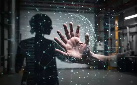Eine Hand, die in eine schemenhafte, digitale Benutzeroberfläche oder ein Netzwerk greift, das KI darstellt, mit einem industriellen Hintergrund. - Foto: über boerse-global.de