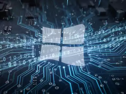 Leuchtend blaue Platine mit Binärcode und transparentem Windows-Logo-Silhouette - Foto: über boerse-global.de