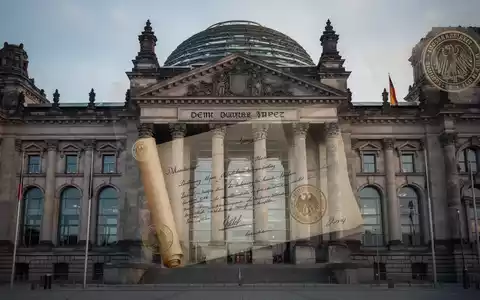 Deutsches Bundestagsgebäude, teilweise verdeckt von einem juristischen Dokument, das die Prüfung der Gesetzgebung symbolisiert. - Foto: über boerse-global.de