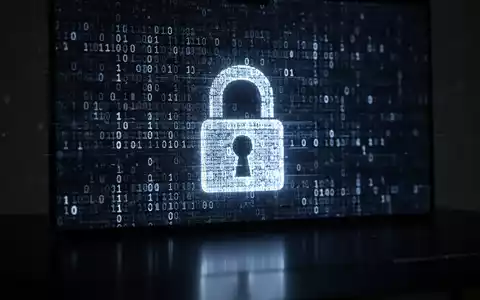 Abstrakte Darstellung von digitalem Sicherheitscode und einem stilisierten Vorhängeschloss auf einem dunklen Bildschirm. - Foto: über boerse-global.de