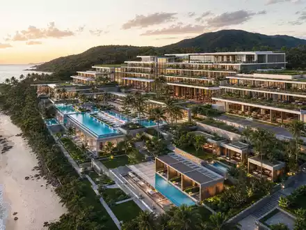 TUI AG (DE000TUAG505) präsentiert einen modernen Architektur-Render eines luxuriösen Strandresorts mit Pools und Gärten - Foto: THN