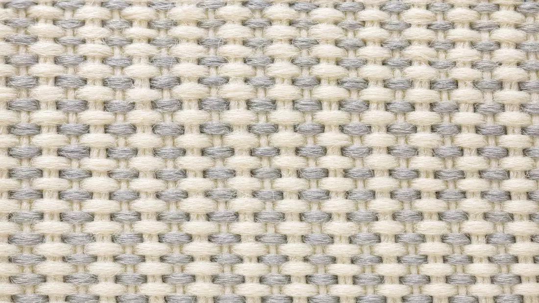 Extreme Makro-Nahaufnahme gewebte Textiltextur einer Sneaker-Innensohle, Creme und Grau