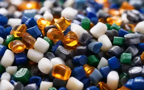 Dow Inc. US2605571031 extreme Makro Aufnahme bunter Kunststoff Granulat Pellets mit verschiedenen Farben und Texturen - Foto: THN