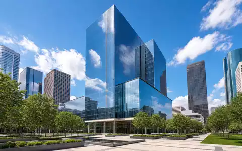 Exxon US30231G1022 zeigt ein modernes Konzern-Hauptquartier als spiegelnden Glasturm im Houston-Architekturstil Texans - Foto: THN