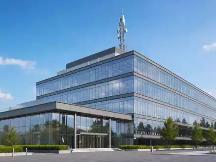 Architektur-Render eines modernen Bürogebäudes mit Antennenmast, passend zur Konzernzentrale von T-Mobile US Inc. (US8725901040) - Foto: THN