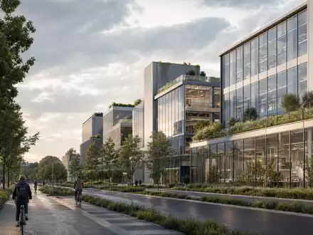 Argenx NL0010832176 moderner belgischer Biotech-Campus mit Glasfassaden und Radfahrern unter bewölktem Herbsthimmel - Foto: THN