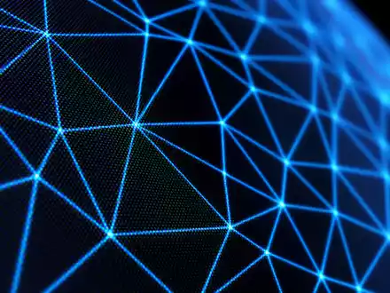 Dassault Systèmes FR0014003TT8 extreme macro of glowing polygon wireframe mesh lines on dark screen - Foto: THN