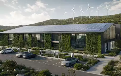 Enel IT0003132476 modernes grünes Energie-Zentrum mit Solarmodulen auf dem Dach und Ladestationen. - Foto: THN