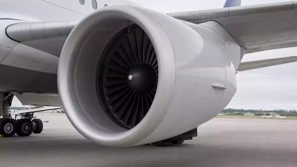 Photorealistic jet engine nacelle under aircraft wing, unbranded